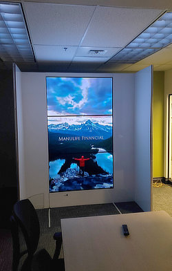 Pioneering 'The Impossible' - This prototype was crucial in the development of the Manulife elevator video wall systems. By situating the mockup within a controlled office environment, I was able to conduct the network engineering and electronics integration with precision, shielded from the potential physical hazards of the production floor. As the housing panel was still in development, these three delicate LG Wallpaper OLED displays -valued at ~$9,500 each- remained exposed to impact damage without the protection of safety glass.